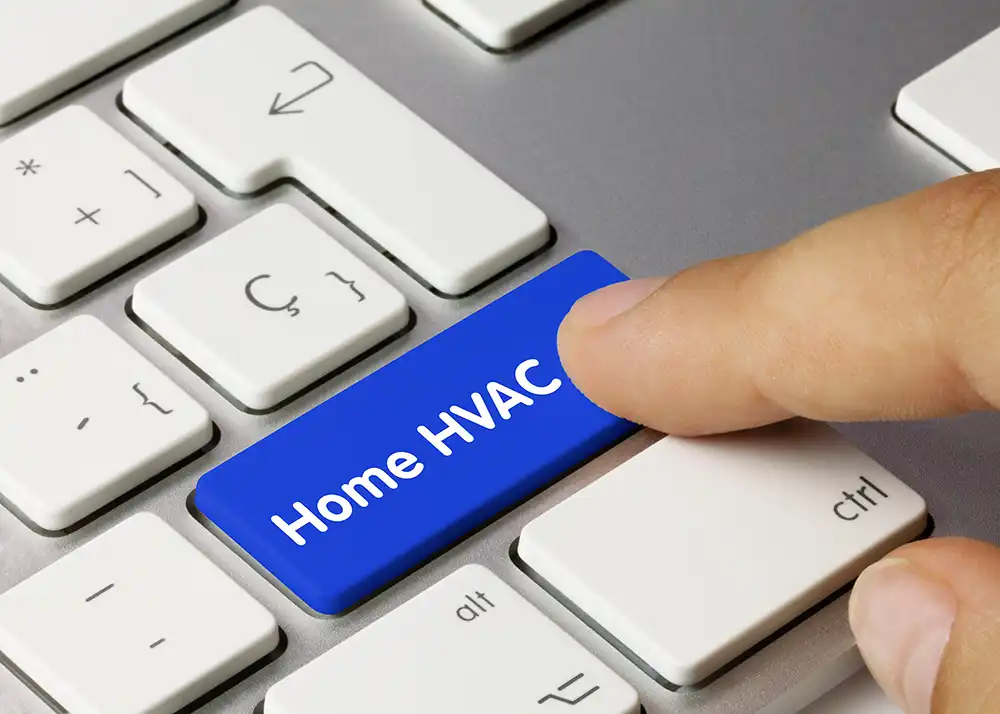 A user's finger pressing a 'Home HVAC' button on a keyboard, highlighting the ease of managing smart heating solutions for home energy efficiency.